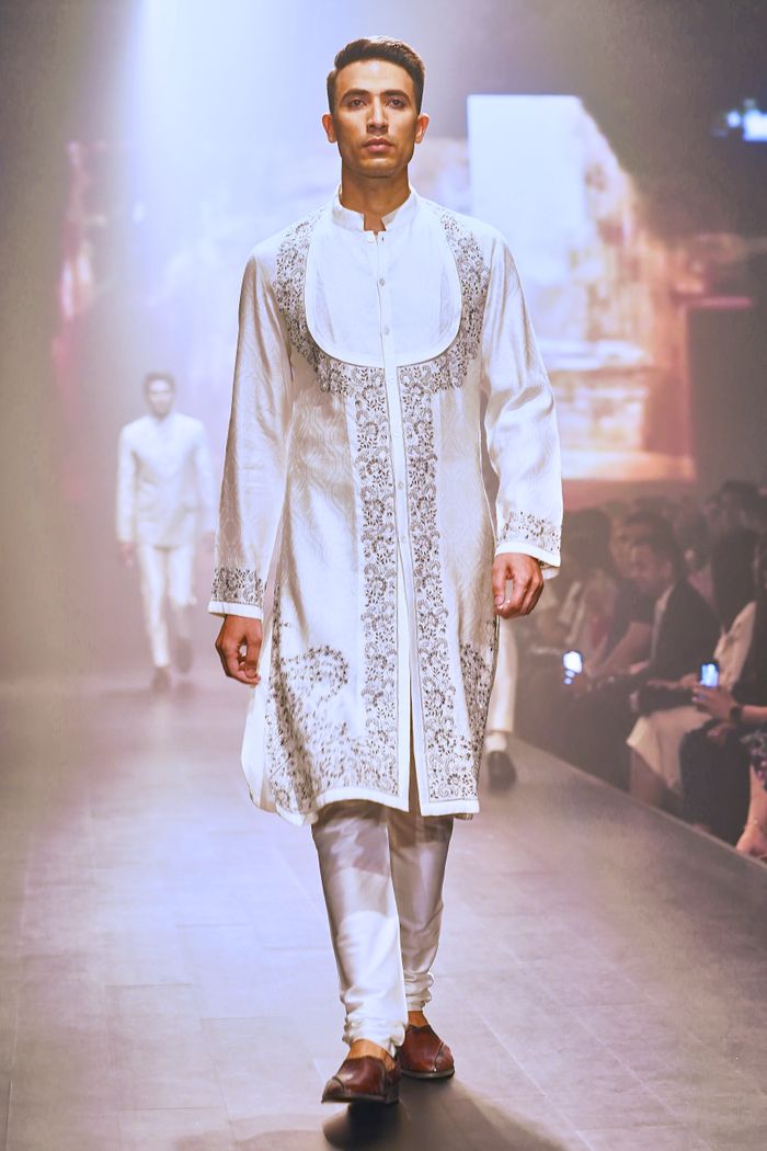The Art of Drawing Readers In: Your attractive post title goes here Model walking in traditional Indian attire during a fashion show.
